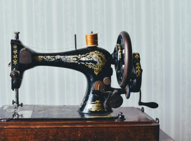black and yellow metal sewing machine