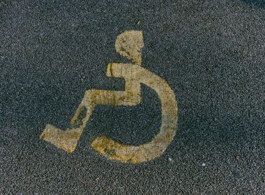a handicapped sign is painted on the pavement
