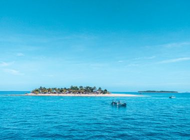people riding on boat on sea during daytime