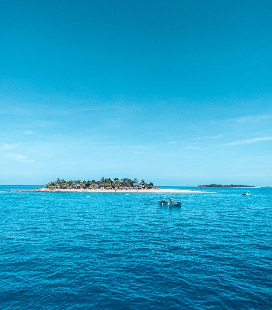 people riding on boat on sea during daytime