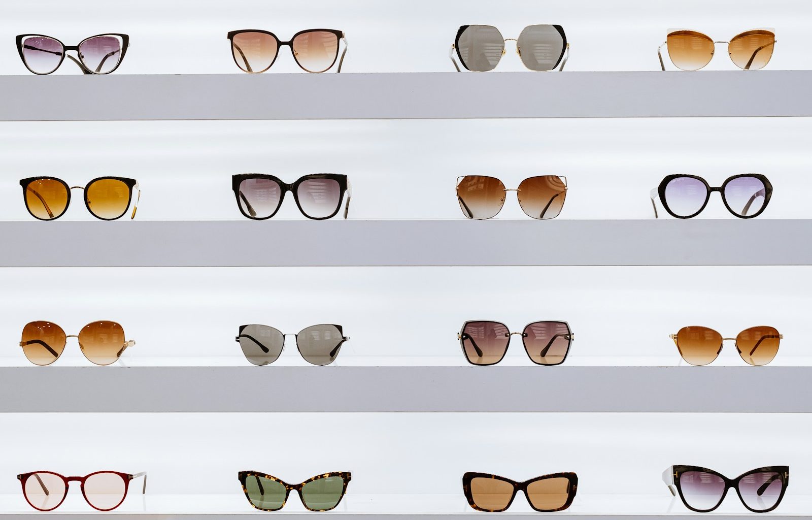 black framed sunglasses on white surface