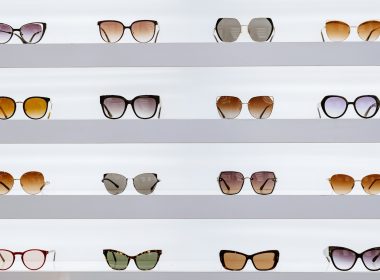 black framed sunglasses on white surface