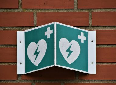 green and white arrow sign