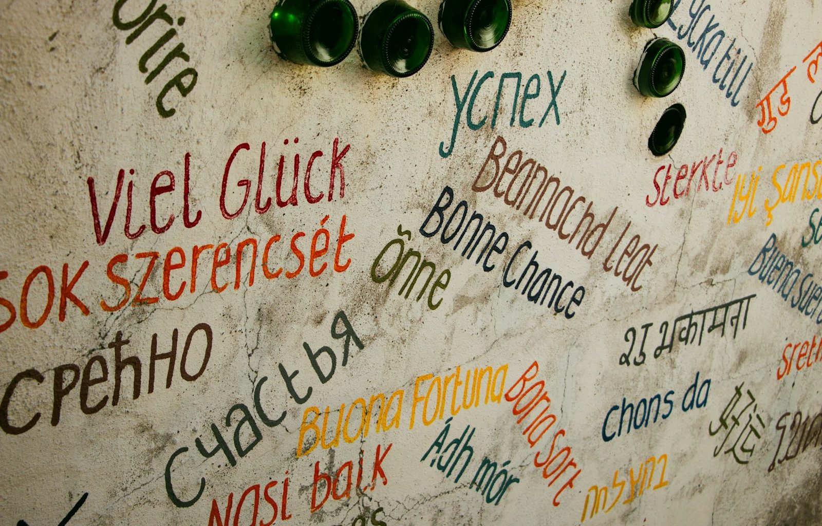 Various good luck wishes in different languages on wall