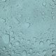 A close up of water droplets on a glass surface