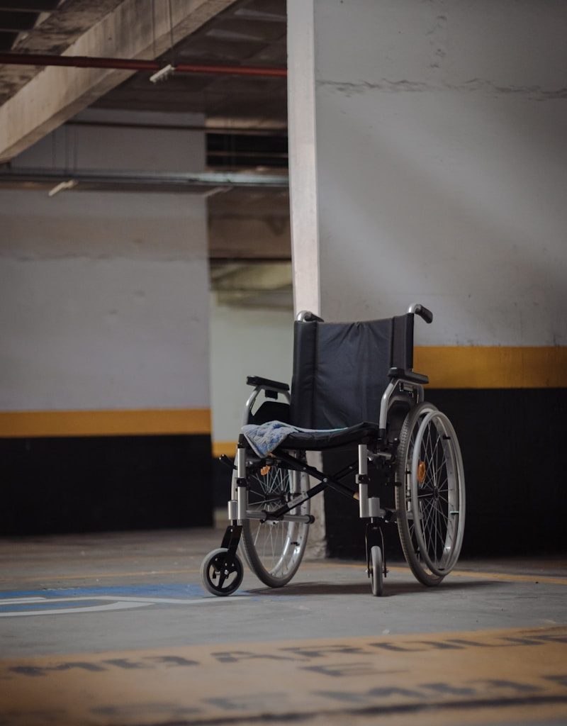 black and gray wheelchair on blue floor