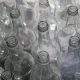 clear glass bottles on brown wooden table