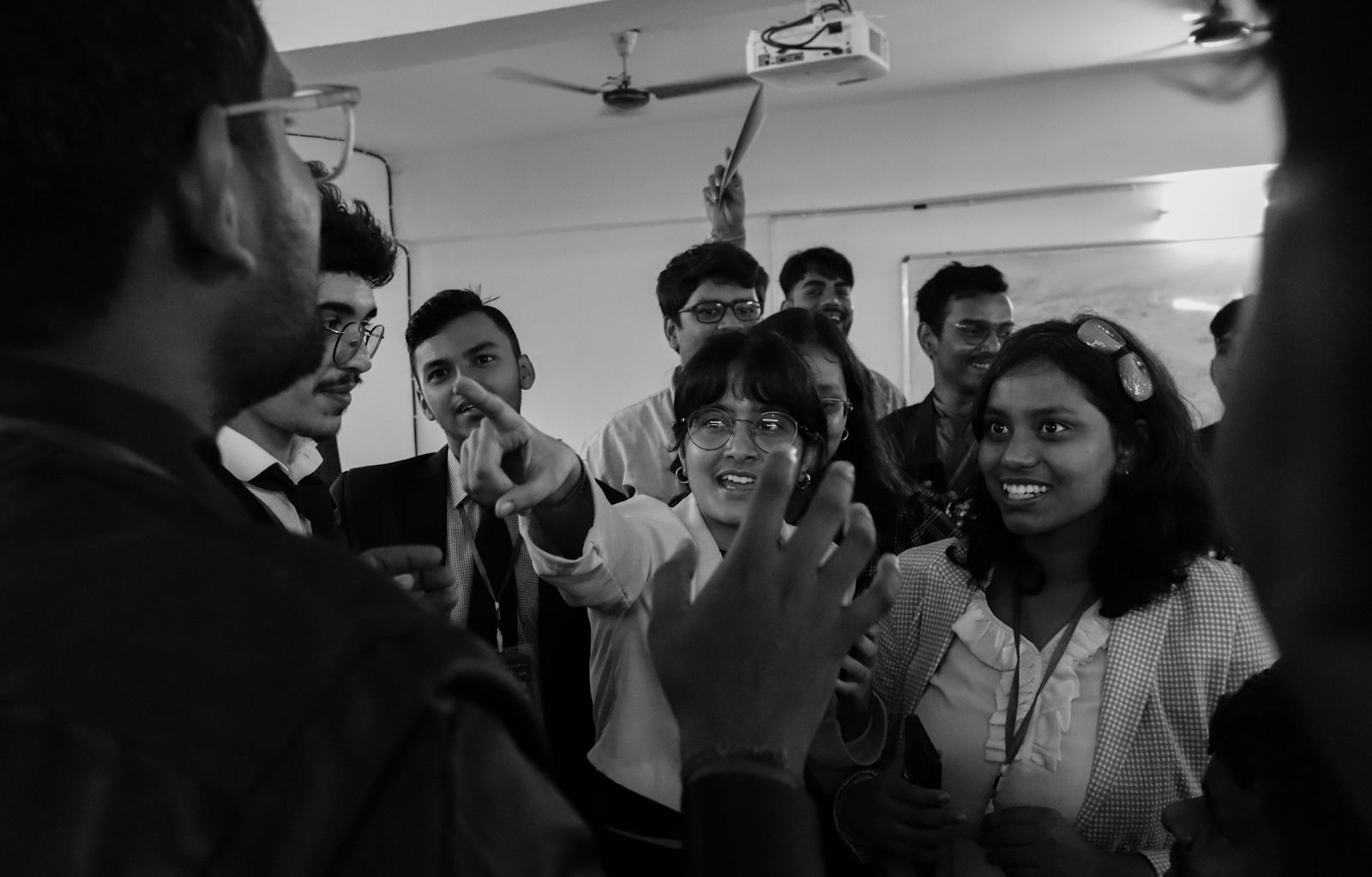 A group of people standing around each other