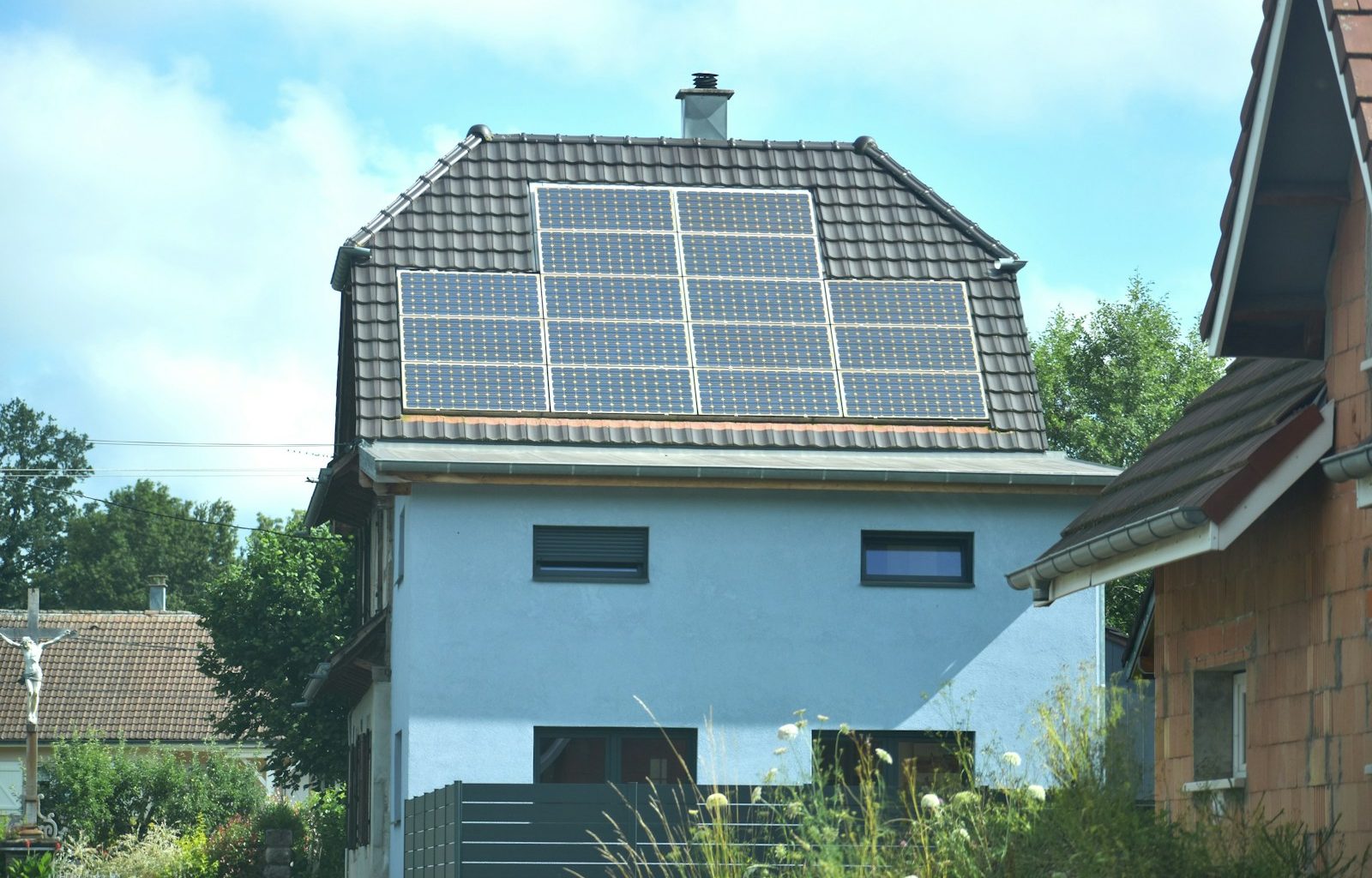 A house with a solar panel on the roof