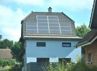 A house with a solar panel on the roof