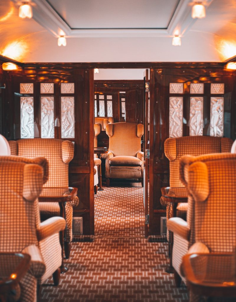 a train car filled with lots of wooden furniture