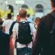 man in black and white shirt carrying black backpack