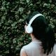 person using white headphones