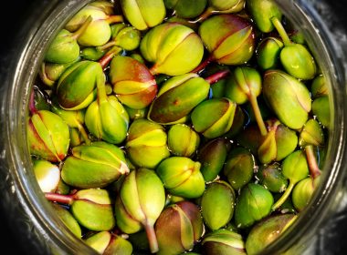 green and brown fruit on clear glass bowl