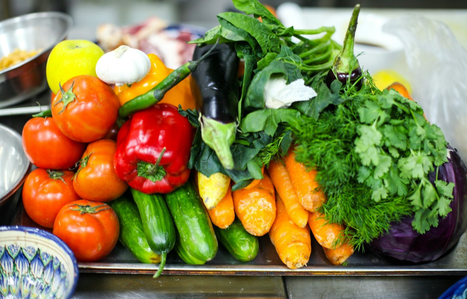 a pile of vegetables sitting on top of a table