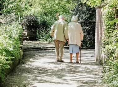 man and woman walking on road during daytime
