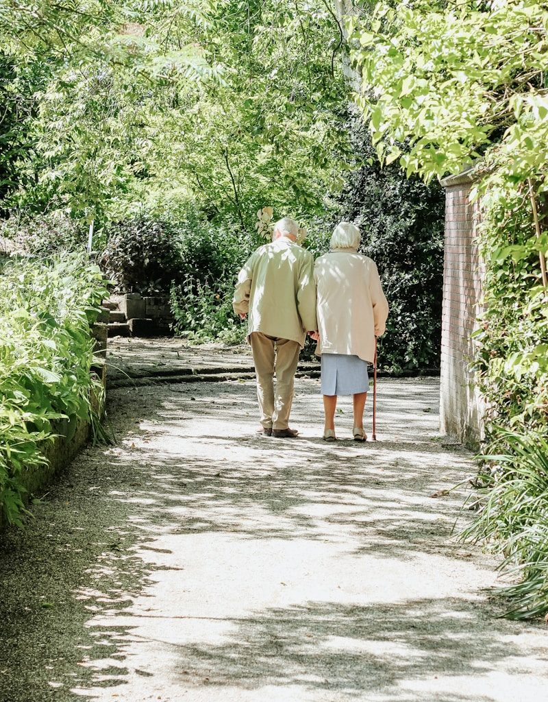 man and woman walking on road during daytime