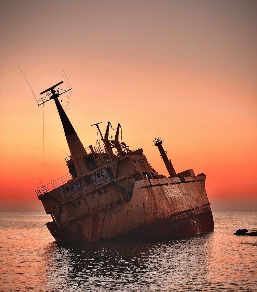 an old rusted ship in the middle of the ocean