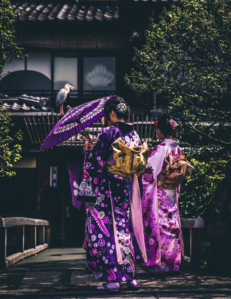 two women in purple and pink kimono