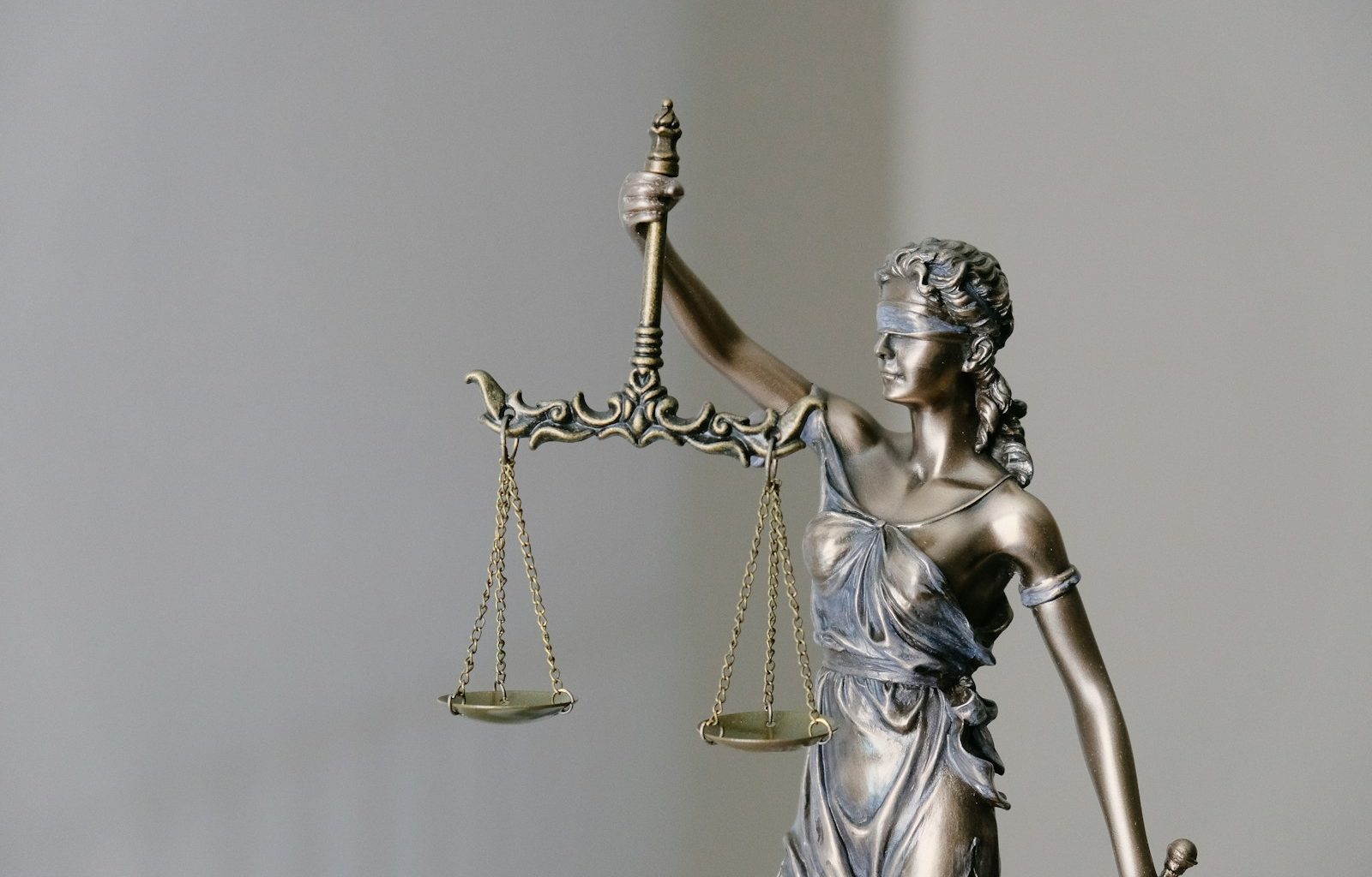 lady justice statue with scales and sword