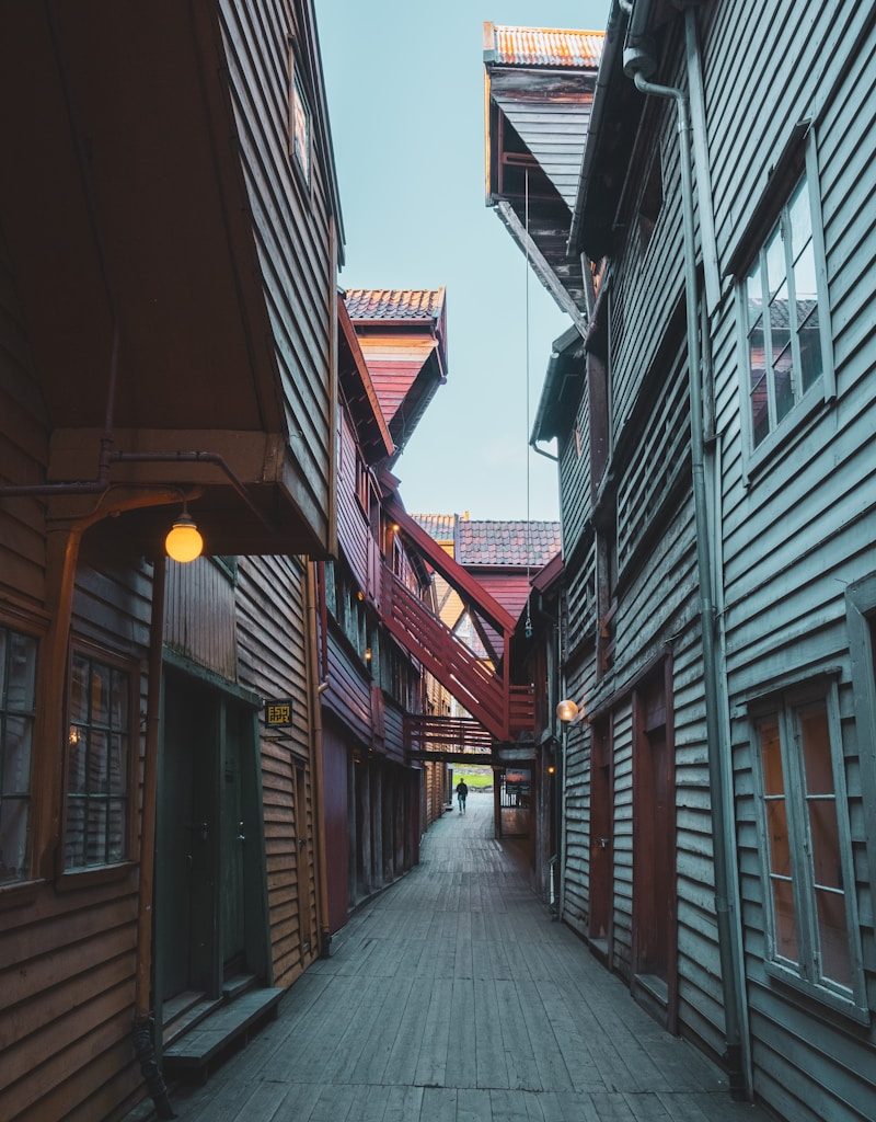 a train is parked on the side of a building